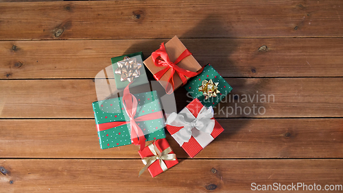 Image of christmas gifts on wooden boards