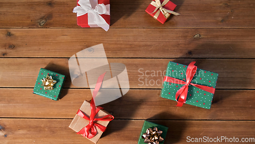 Image of christmas gifts on wooden boards