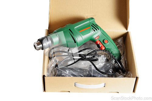 Image of Electric drill in a box.