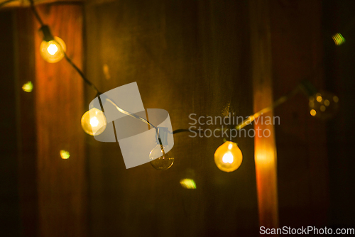 Image of deck or porch decorated with lights