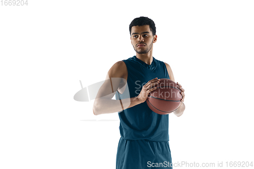 Image of Young arabian basketball player of team posing isolated on white background. Concept of sport, movement, energy and dynamic.