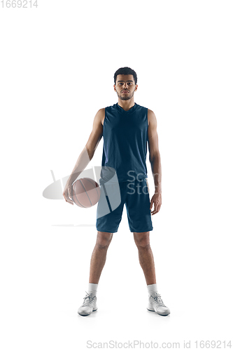Image of Young arabian basketball player of team posing isolated on white background. Concept of sport, movement, energy and dynamic.