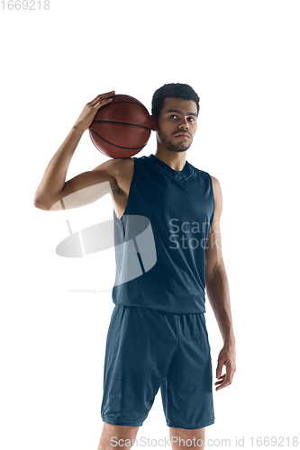 Image of Young arabian basketball player of team posing isolated on white background. Concept of sport, movement, energy and dynamic.