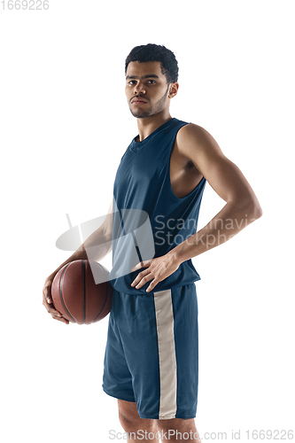 Image of Young arabian basketball player of team posing isolated on white background. Concept of sport, movement, energy and dynamic.