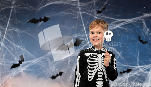 Image of boy in halloween costume of skeleton making faces