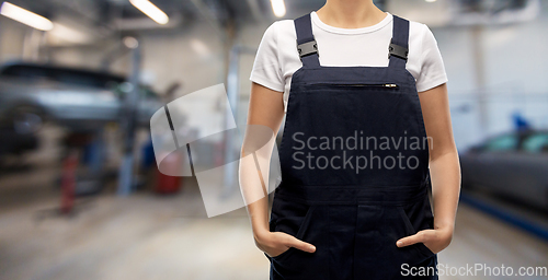 Image of close up of female worker at car service