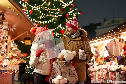 Image of family with takeaway drinks at christmas market