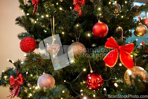 Image of decorated artificial christmas tree at home