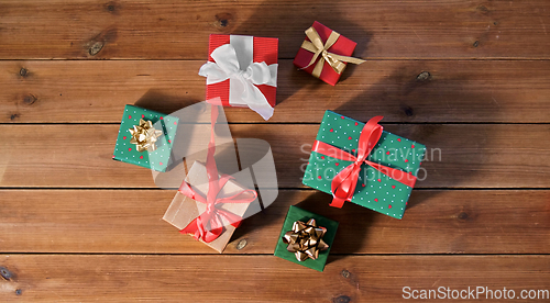 Image of christmas gifts on wooden boards