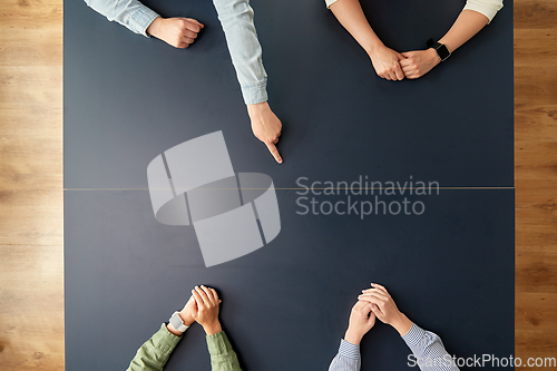 Image of business team sitting at office table