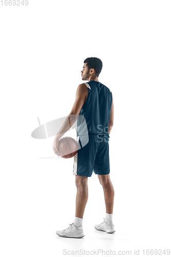 Image of Young arabian basketball player of team posing isolated on white background. Concept of sport, movement, energy and dynamic.