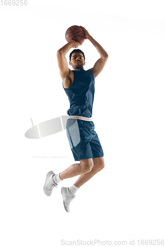 Image of Young arabian basketball player of team in action, motion isolated on white background. Concept of sport, movement, energy and dynamic.