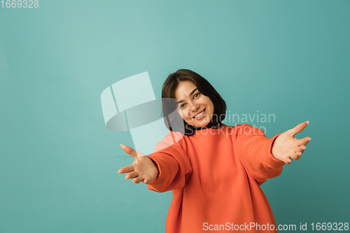 Image of Caucasian woman\'s portrait isolated on blue studio background with copyspace