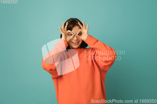 Image of Caucasian woman\'s portrait isolated on blue studio background with copyspace