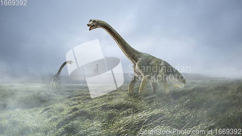 Image of Dinosaurs huge higth walking through the jungle, foggy mountains