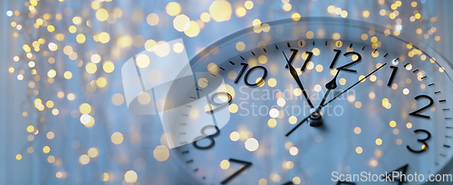 Image of wall clock with christmas lights