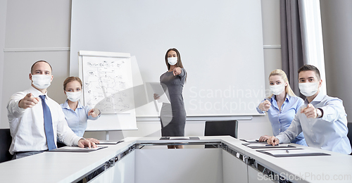 Image of businesspeople in masks pointing finger at you