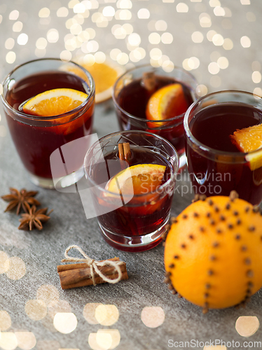 Image of glasses of mulled wine with orange and cinnamon