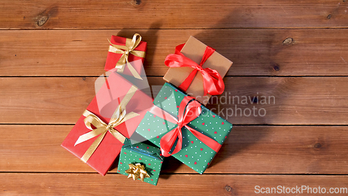 Image of christmas gifts on wooden boards