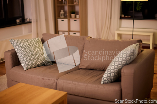 Image of sofa with cushions at cozy home living room
