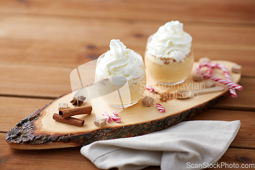 Image of glasses of eggnog with whipped cream and anise