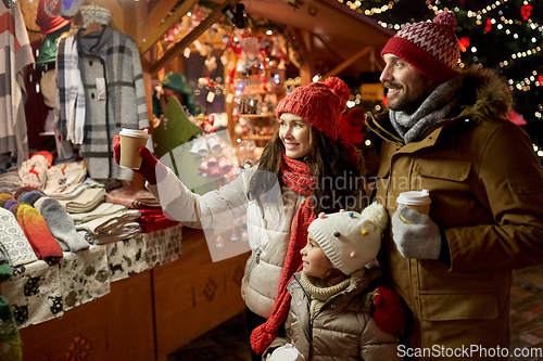 Image of family with takeaway drinks at christmas market