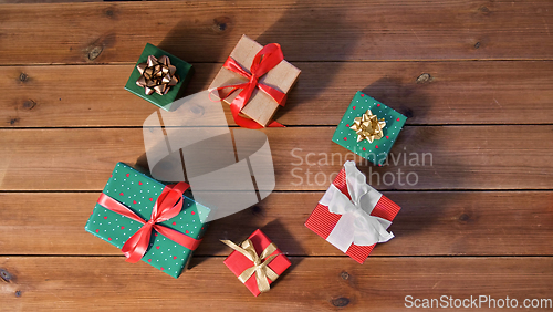 Image of christmas gifts on wooden boards