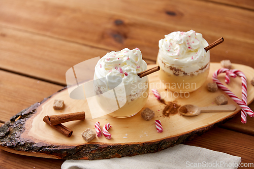 Image of glasses of eggnog with whipped cream and anise