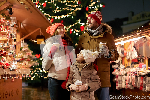 Image of family with takeaway drinks at christmas market