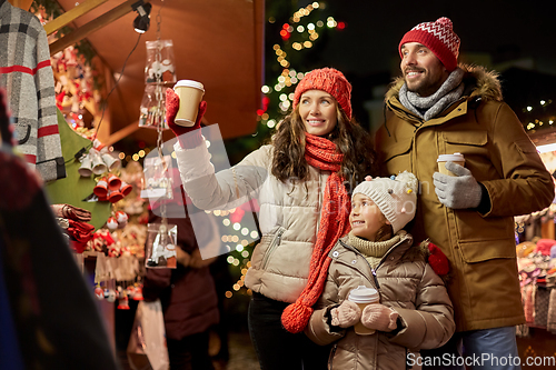 Image of family with takeaway drinks at christmas market