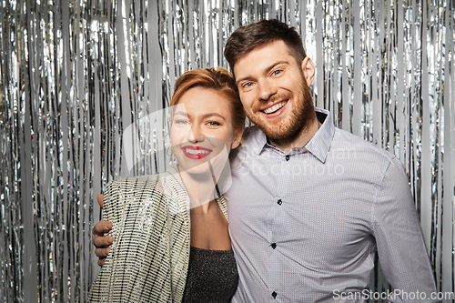 Image of happy hugging couple in party clothes