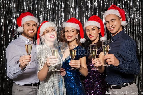 Image of friends with champagne glasses at christmas party