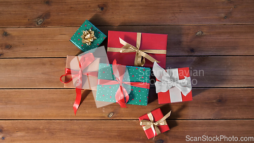 Image of christmas gifts on wooden boards