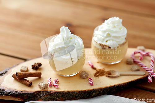 Image of glasses of eggnog with whipped cream and anise