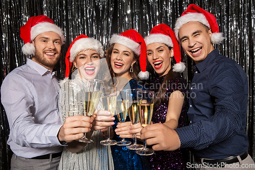 Image of friends with champagne glasses at christmas party