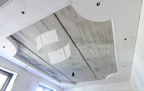 Image of Installation of a two-level ceiling with lighting, floors of reinforced concrete slabs