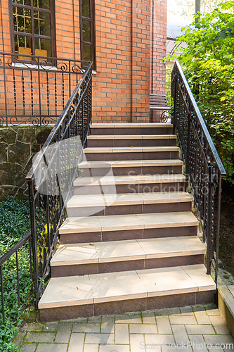 Image of Beautiful staircase with metal railings, close-up