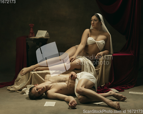 Image of Modern remake of classical artwork - young medieval couple on dark background, comparison of eras concept