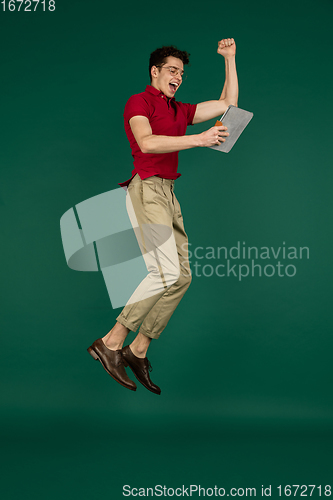 Image of Caucasian man\'s portrait isolated on green studio background with copyspace