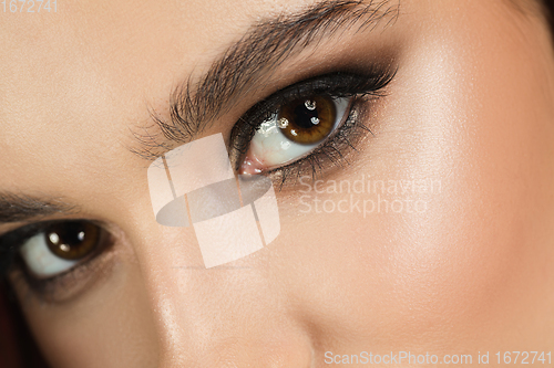 Image of Close up of female fashion model\'s face with eye smoky make up. Style and beauty concept.