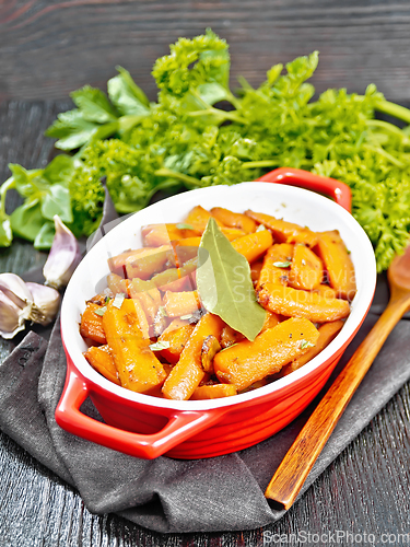 Image of Carrots fried in pan on napkin