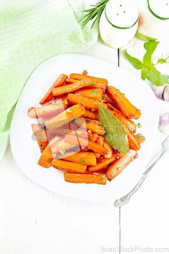 Image of Carrots fried in plate on light board top