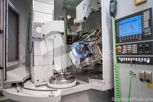 Image of Metalworking CNC milling machine. Cutting metal modern processin