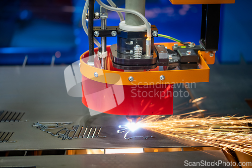 Image of CNC Laser cutting of metal, modern industrial technology.