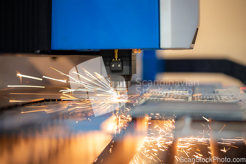 Image of CNC Laser cutting of metal, modern industrial technology.