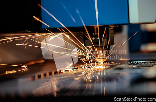 Image of CNC Laser cutting of metal, modern industrial technology.