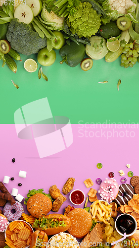 Image of Fast and healthy food compared on pink-green background. Unhealthy set including burgers, sauces, french fries in comparison with vegetables, fruits, organic food