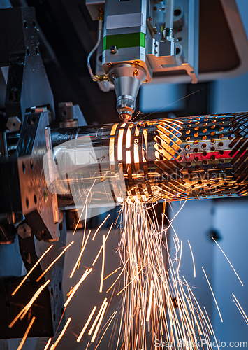 Image of CNC Laser cutting of metal, modern industrial technology.