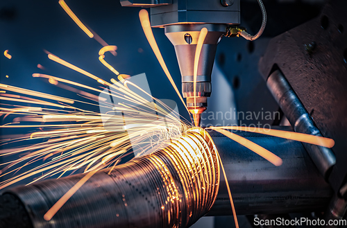 Image of CNC Laser cutting of metal, modern industrial technology.