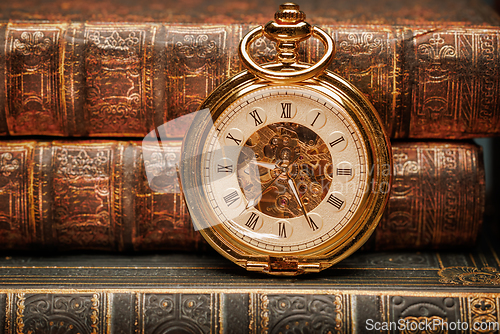 Image of Old Books and Vintage pocket watch